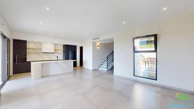 Open-plan kitchen and living area at Plumbago Residences, Cole Bay