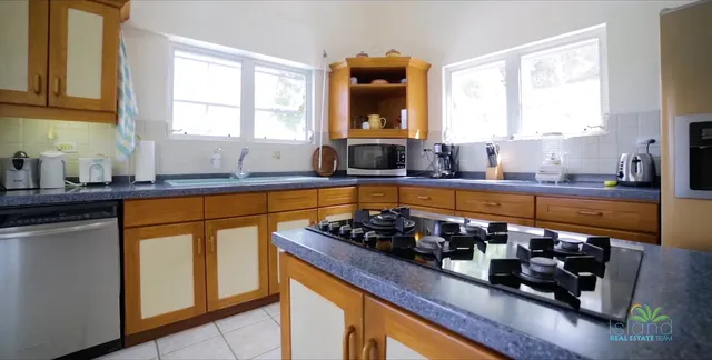 Kitchen with wood cabinetry and gas range