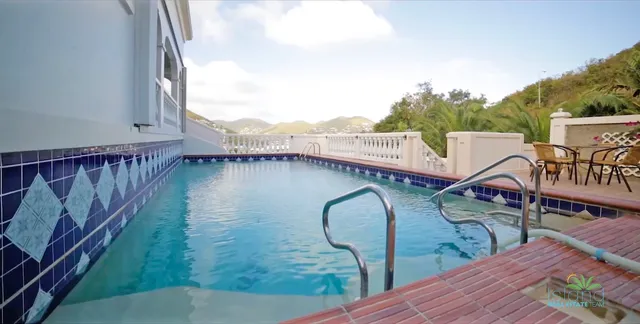Private pool with tiled deck at the Cay Hill villa