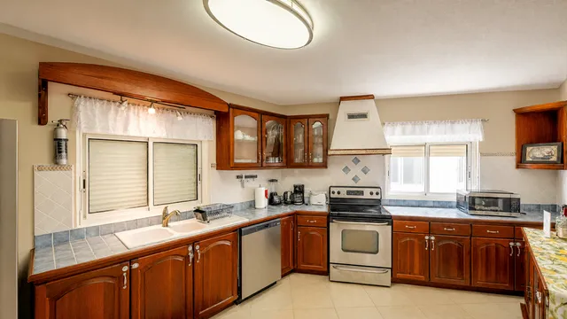 Kitchen with wood cabinetry and stainless appliances
